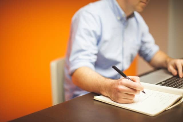 The 5 Step-Guide to Writing any College Essay 2 man people space desk