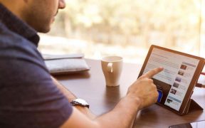 Man Holding Tablet Computer