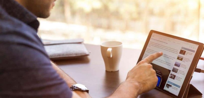 man holding tablet computer