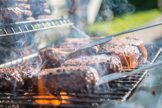 close photography of grilled meat on griddle 1105325