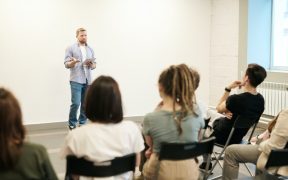man wearing gray dress shirt and blue jeans 3184317